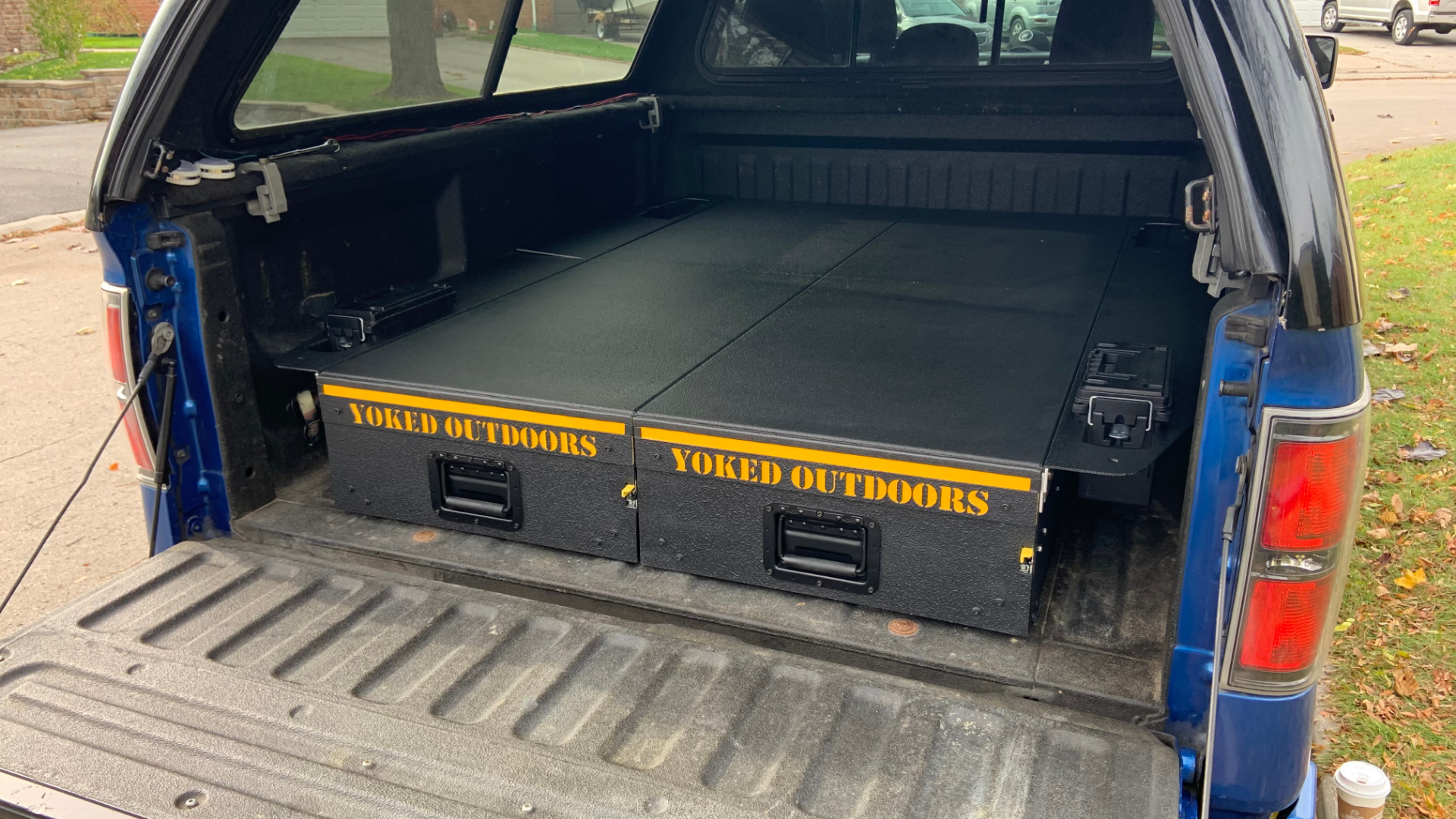 Pickup bed outlet drawer system